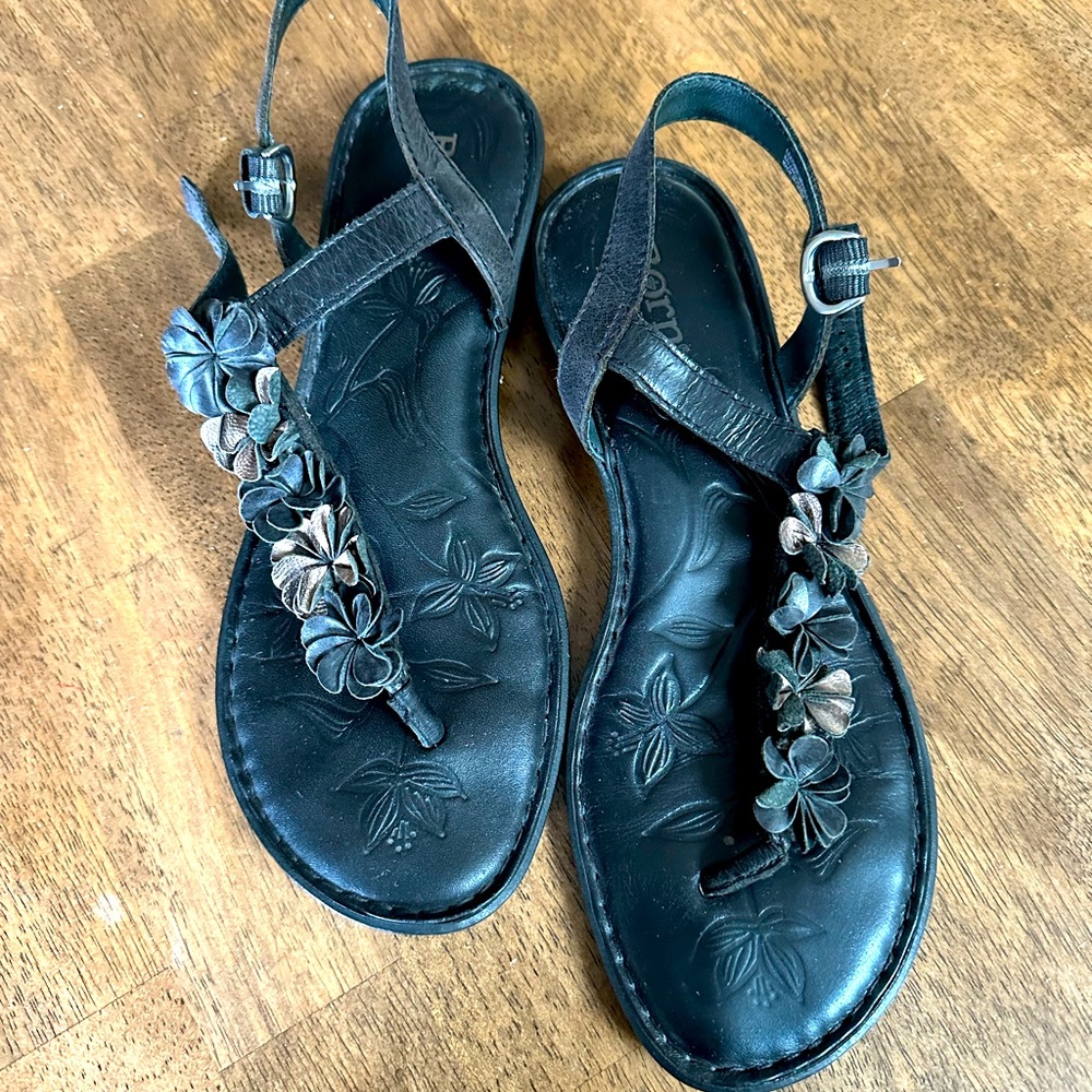 Born size 8 black sandals with adjust. strap, flowers black and metallic